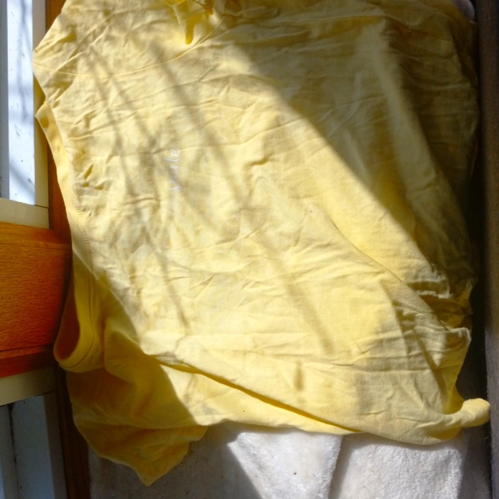 Yellow shirt that says smile